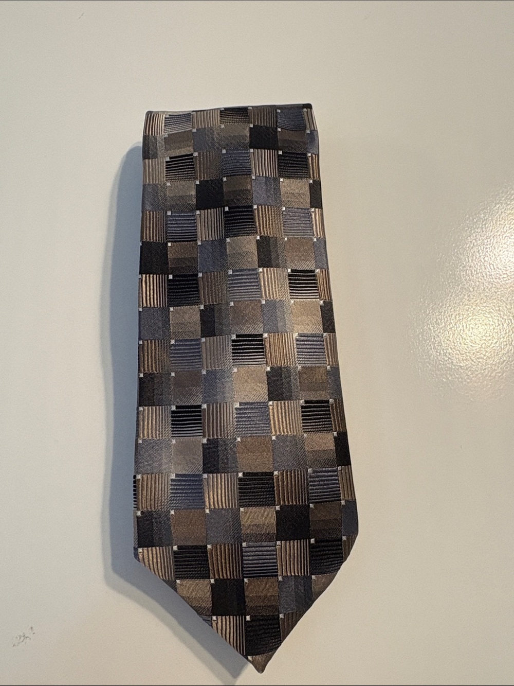Black, tan, and grey silk tie.